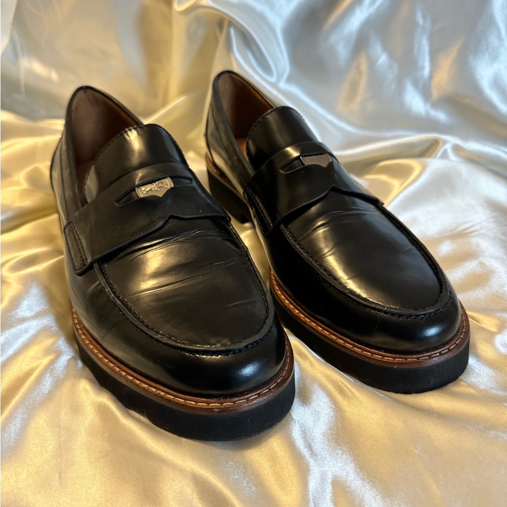 Coach black loafers.